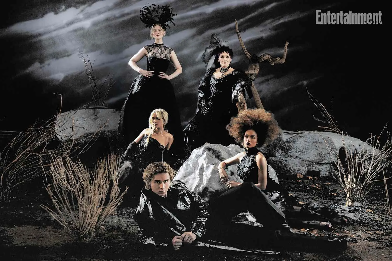 Joseph Zada, Whitney Peak, Mckenna Grace, Elle Fanning and Glenn Close dressed in black on a dark, rocky set under a stormy sky, with the Entertainment Weekly masthead at top right