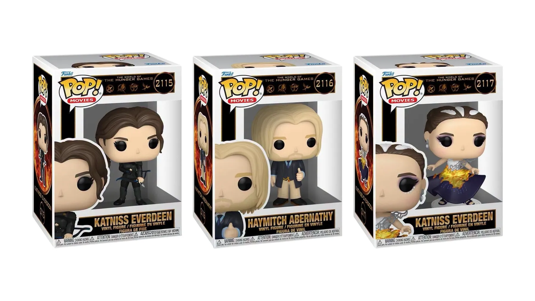 The three boxed figures, showing the numbering and 'The World of The Hunger Games' banner with four film emblems