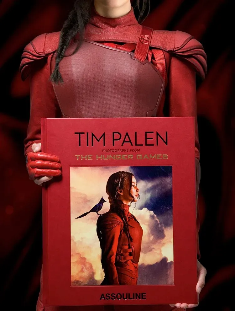 The Ultimate Edition held upright, showing the scale of the 39 × 47 cm volume against its red presentation case