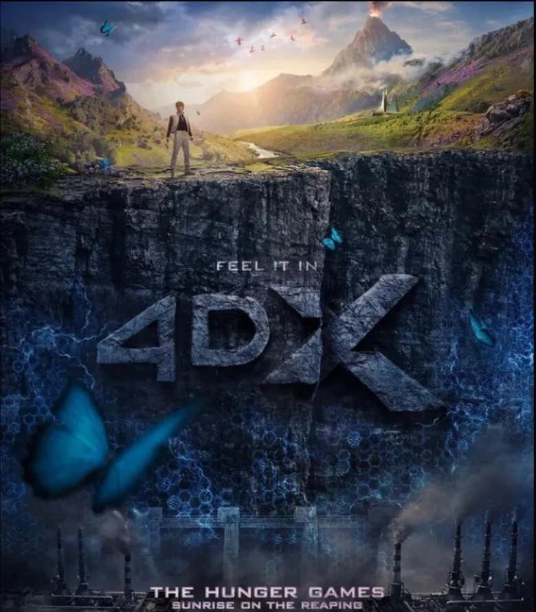 The 4DX poster: Haymitch on a cliff edge with the arena meadow and volcano above and District 12's smokestacks below, blue butterflies in the foreground