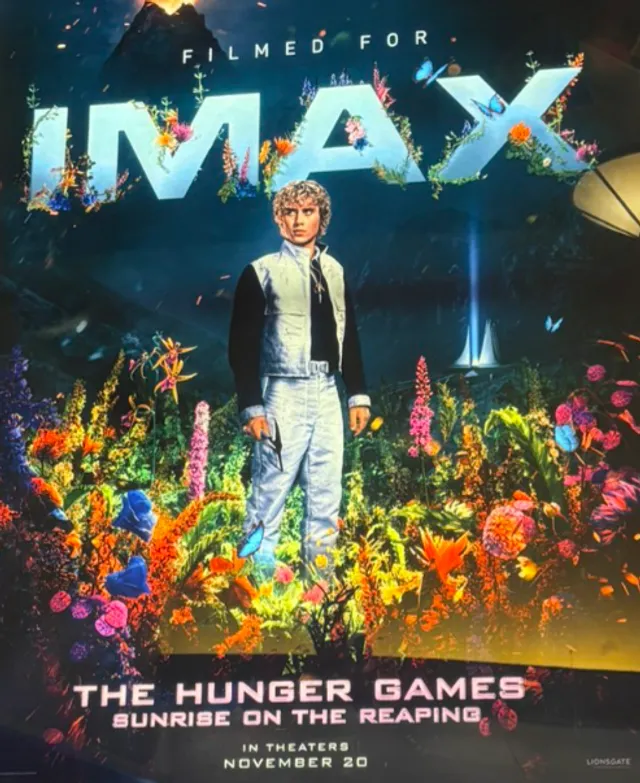 Joseph Zada as Haymitch Abernathy holds a short sword in the 50th Hunger Games arena