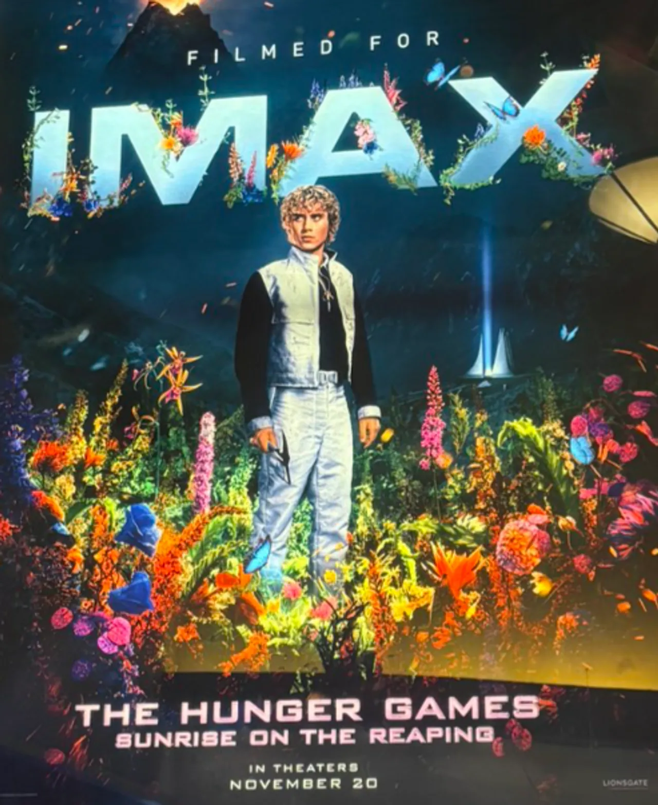 Joseph Zada as Haymitch Abernathy holds a short sword in the 50th Hunger Games arena