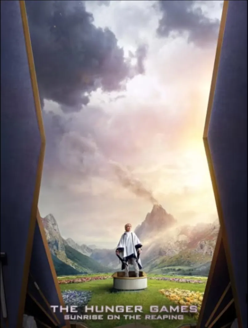 The ScreenX poster: Haymitch on his launch plate in a white poncho, the arena valley and volcano behind him, framed by angled auditorium walls