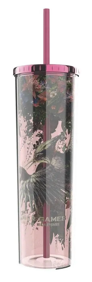 Village Cinemas' Sunrise on the Reaping tumbler: a clear pink cup with a pink lid and straw, printed with flowers, a mockingjay and the film's title.