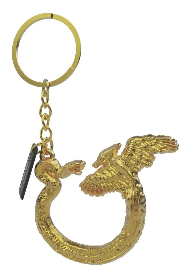 The Sunrise on the Reaping flint striker key chain: a gold ring with a snake and a mockingjay curled into a circle, with a small black striker hanging from the chain.