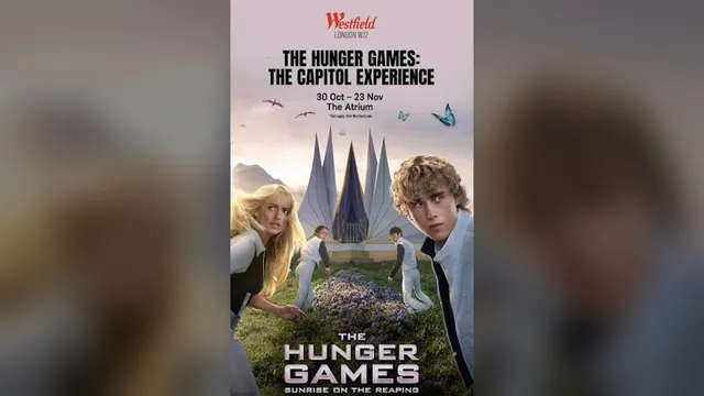 Westfield London poster for The Hunger Games: The Capitol Experience, showing Joseph Zada as Haymitch and fellow tributes in a flower meadow in front of the Cornucopia